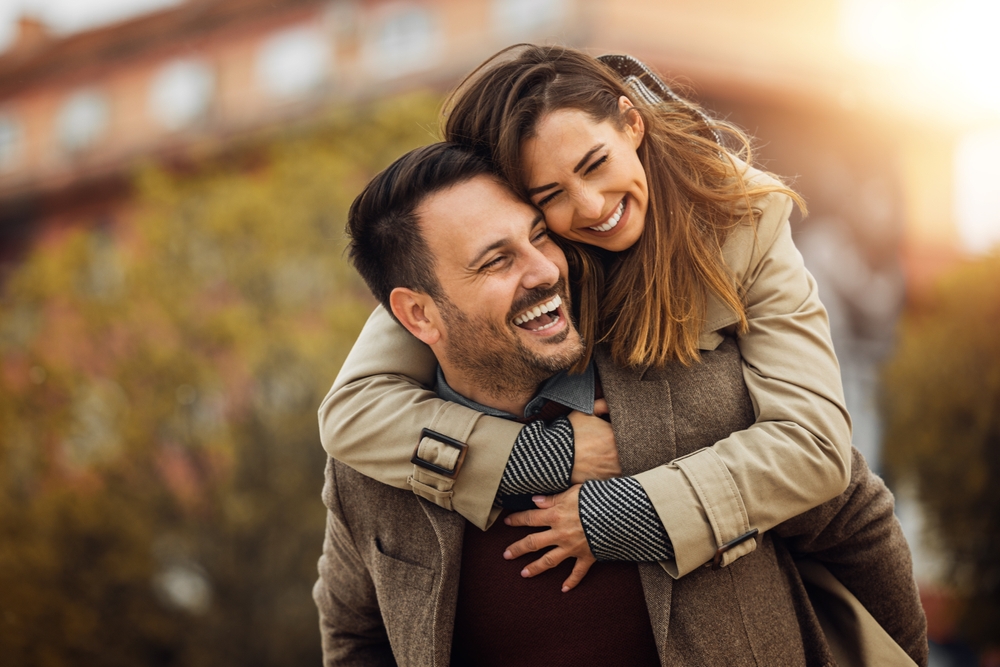 Loving,Young,Couple,Hugging,And,Smiling,Together,Outdoors. after overcoming their anxiety over dating